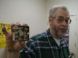 W3CDE, Jerry displaying his resonant speaker built from home security system parts